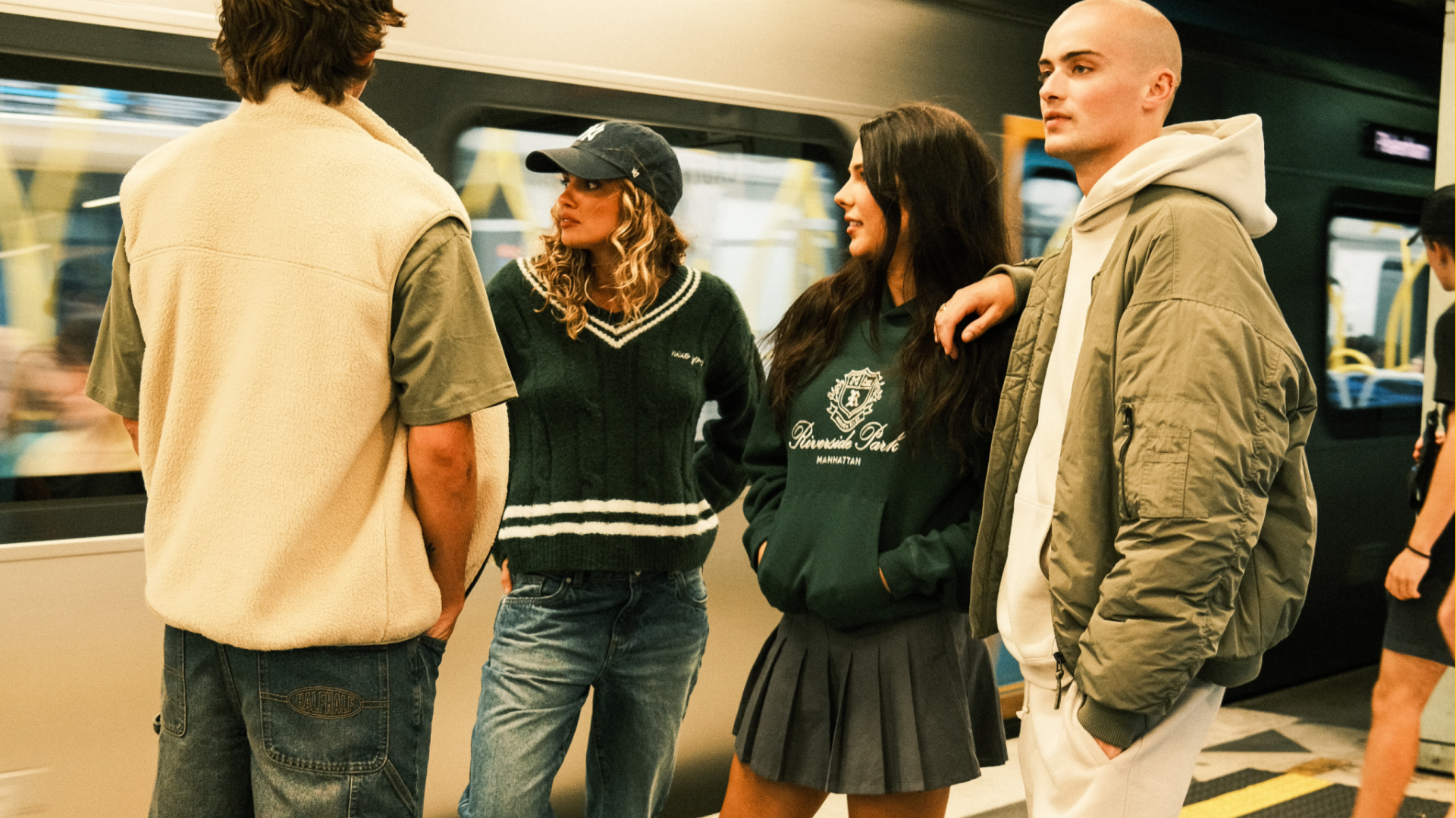 Teenagers standing at train station